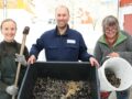 Anniken Fure Stensrud, Joshua Cabell and Anne-Kristin Løes ceushing a batch of mussels for the compost trial.